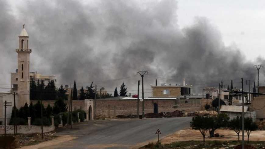 Smoke rises from burnt factories after being shelled at Khan al-Assal November 10, 2012. Picture taken November 10, 2012. REUTERS/Zain Karam (SYRIA - Tags: CONFLICT) - RTR3A97R