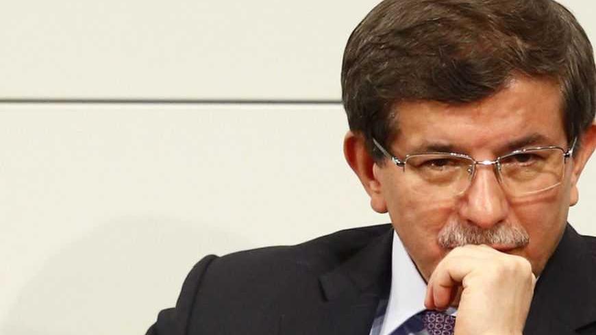 Turkish Foreign Minister Ahmet Davutoglu pauses during the 49th Conference on Security Policy in Munich February 3, 2013. Senior politicians along with the leader of the Syrian opposition are in Munich providing a rare opportunity for talks to revive efforts to end the civil war in Syria. REUTERS/Michael Dalder (GERMANY - Tags: MILITARY POLITICS) - RTR3DALG