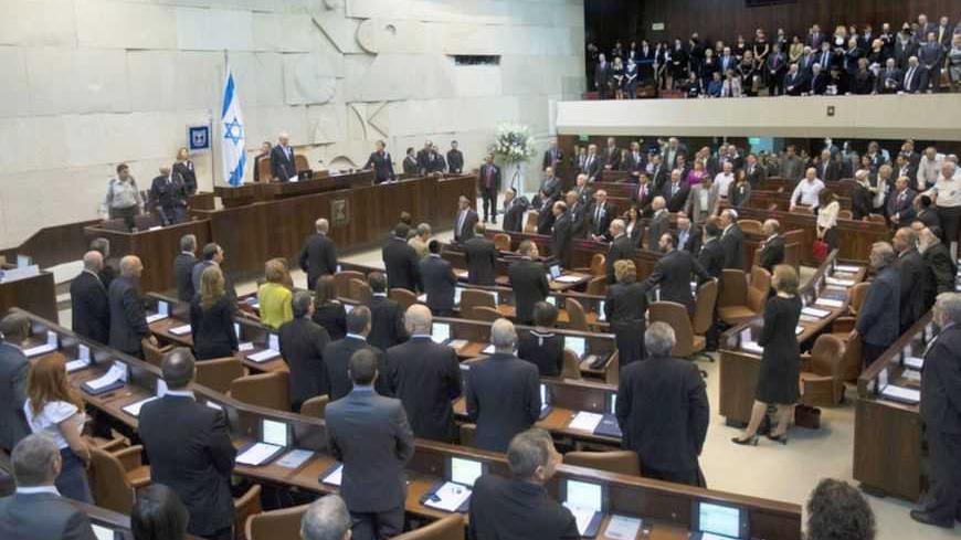 Members of the 19th Knesset, the new Israeli parliament, stand as President Shimon Peres arrives to their swearing-in ceremony at the parliament in Jerusalem February 5, 2013. REUTERS/Ronen Zvulun (JERUSALEM - Tags: POLITICS) - RTR3DDTH
