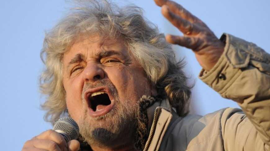 Five-Star Movement leader and comedian Beppe Grillo gestures during a rally in Turin February 16, 2013. REUTERS/Giorgio Perottino (ITALY - Tags: POLITICS ELECTIONS) - RTR3DVM1
