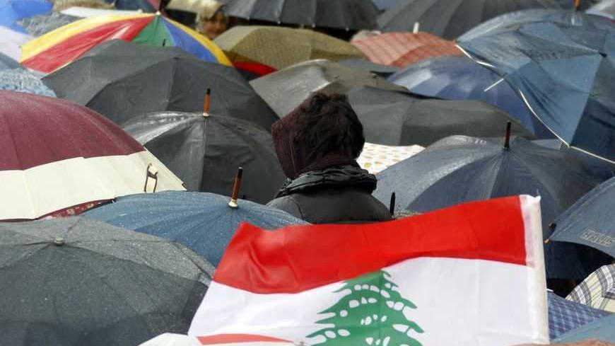 Teachers protest in front of the Grand Serail, the government headquarters in Beirut February 19, 2013. The teachers' Union Coordination Committee (UCC) announced an open-ended strike from Tuesday after the Cabinet failed to assemble on Monday to ratify a long-awaited wage hike to be sent to parliament for its approval.   REUTERS/Sharif Karim (LEBANON - Tags: POLITICS CIVIL UNREST EDUCATION) - RTR3DZA1