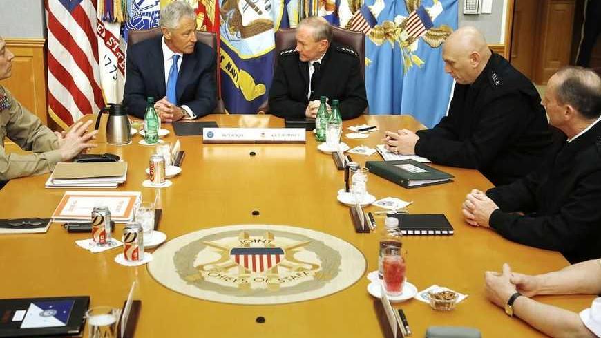 U.S. Secretary of Defense Chuck Hagel (2nd L) holds his first meeting with the Joint Chiefs of Staff U.S. Marine Corps Commandant General John M. Paxton, Jr. (L), U.S. Army General Martin Dempsey (4th R), General of the Army Ray Odierno (3rd R), U.S. Navy Chief of Naval Operations Admiral Jon Greenert (2nd R) and U.S. Army General Frank Grass (R) in a briefing room called "The Tank" at the Pentagon in Arlington, Virginia, March 1, 2013.  REUTERS/Jonathan Ernst    (UNITED STATES - Tags: POLITICS MILITARY) - 