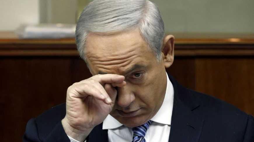 Israel's Prime Minister Benjamin Netanyahu attends the weekly cabinet meeting in Jerusalem March 3, 2013. More than a month after Israel's election, Netanyahu is still without a new coalition, his hopes of enlisting traditionally loyal cabinet partners - ultra-Orthodox factions - challenged by a pact between an odd political couple. REUTERS/Gali Tibbon/Pool (JERUSALEM - Tags: POLITICS) - RTR3EII7