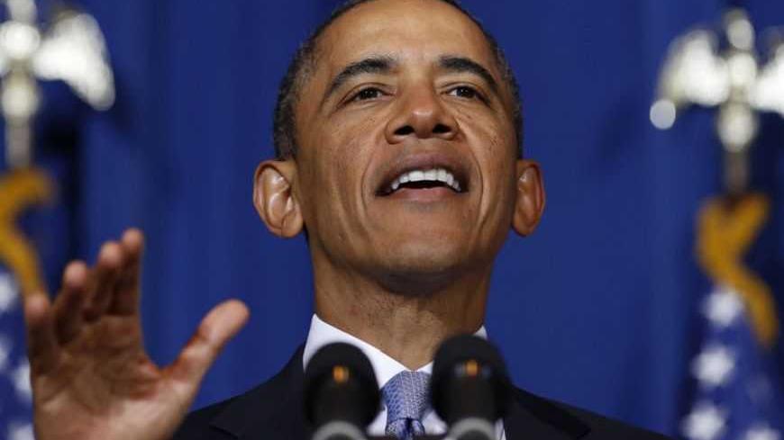 U.S. President Barack Obama talks to the audience before he signs the Violence Against Women Act while at the Department of Interior in Washington, March 7, 2013.          REUTERS/Larry Downing  (UNITED STATES - Tags: POLITICS) - RTR3EPDP