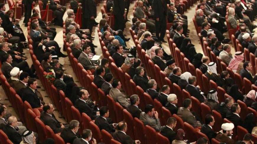 Members of the new Iraqi Parliament attend a session at the Parliament headquarters in Baghdad, November 11, 2010. Iraq's fractious politicians have agreed to return Shi'ite Nuri al-Maliki as prime minister, ending an eight-month deadlock that raised fears of renewed sectarian war, but leaving some Sunnis sceptical he can forge national unity. The pact on top government posts brings together Shi'ites, Sunnis and Kurds in a power-sharing arrangement similar to the last Iraqi government and could help prevent