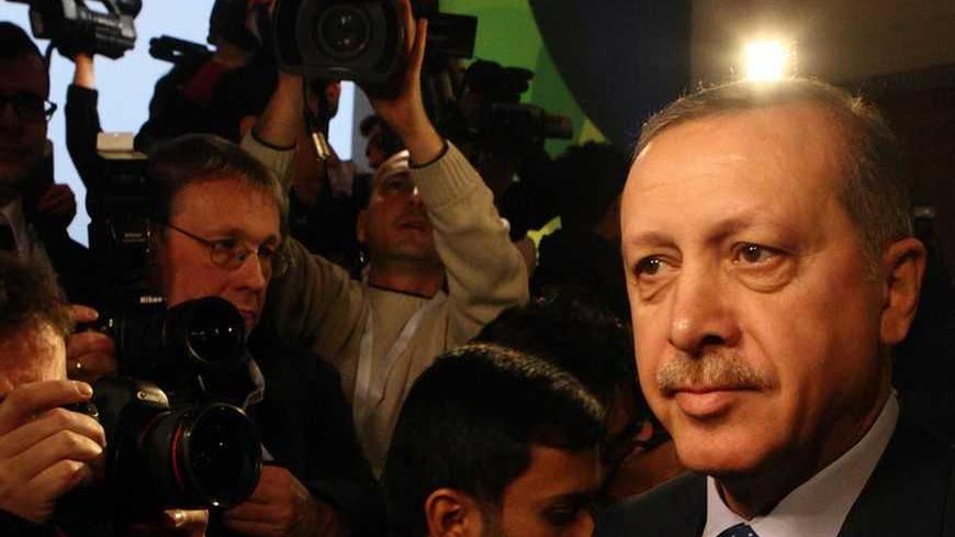 Turkey's Prime Minister Tayyip Erdogan arrives for the fifth United Nations Alliance of Civilizations (UNAOC) forum in Vienna, February 27, 2013. REUTERS/Heinz-Peter Bader  (AUSTRIA - Tags: POLITICS) - RTR3ECAG