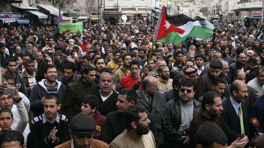 Protesters from the Islamic Action Front and other opposition parties shout slogans to demand political and economic reform, and access to corruption cases, during a demonstration after Friday prayers in Amman February 22, 2013. REUTERS/Majed Jaber (JORDAN - Tags: POLITICS CIVIL UNREST) - RTR3E4AO