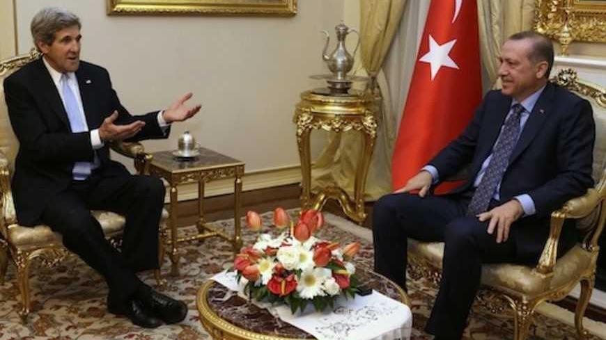 U.S. Secretary of State John Kerry (L) meets with Turkish Prime Minister Tayyip Erdogan at Ankara Palace in Ankara, March 1, 2013. Kerry said on Friday the United States found a comment by Turkey's prime minister, likening Zionism to crimes against humanity, "objectionable", overshadowing their talks on the crisis in neighbouring Syria. REUTERS/Jacquelyn Martin/Pool (TURKEY - Tags: POLITICS) - RTR3EG91