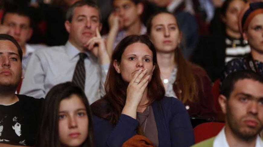 Students listen to U.S. President Barack Obama talk at the Jerusalem Convention Center in Jerusalem, March 21, 2013. President Obama, delivering a keynote speech to Israeli students, said on Thursday that continued settlement activity was "counterproductive" to peace and urged Israelis to accept the Palestinians' right to self-determination.     REUTERS/Larry Downing  (JERUSALEM - Tags: POLITICS) - RTR3F9Z6