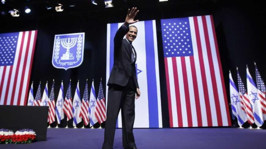 U.S. President Barack Obama acknowledges the audience after delivering a speech on policy at the Jerusalem Convention Center, March 21, 2013. President Obama, delivering a keynote speech to Israeli students, said on Thursday that continued settlement activity was "counterproductive" to peace and urged Israelis to accept the Palestinians' right to self-determination. REUTERS/Jason Reed (JERUSALEM - Tags: POLITICS) - RTR3F9ZN