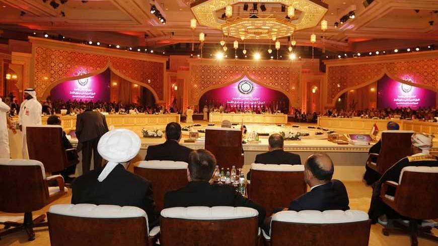 Leaders from Arab states are seen attending the opening of the Arab League summit in Doha March 26, 2013. A summit of Arab heads of state opened in the Qatari capital Doha on Tuesday expected to focus on the war in Syria as well as on the Israeli-Palestinian conflict.  REUTERS/Ahmed Jadallah (QATAR - Tags: POLITICS) - RTXXXR4