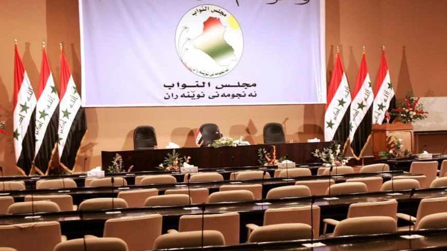 The room where Iraq's parliament was to meet today, for only the second time since it was elected in December, remains empty after politicians cancelled today's session, April 20, 2006.  Iraq's Shi'ite Alliance said on Thursday it would hold a new internal vote to name a prime minister, raising the possibility that Ibrahim al-Jaafari will be removed to end a months-long impasse over a unity government.  REUTERS/Ahmad Rubaye/Pool - RTR1CMS1