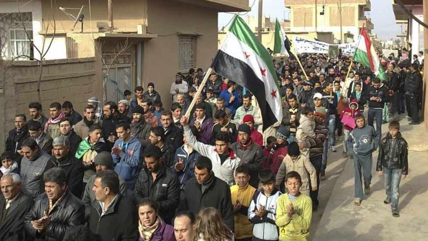 Demonstrators protest against Syria's President Bashar al-Assad after Friday prayers in Amude, January 6, 2012. Picture taken January 6, 2012.  REUTERS/Handout (SYRIA - Tags: POLITICS CIVIL UNREST) FOR EDITORIAL USE ONLY. NOT FOR SALE FOR MARKETING OR ADVERTISING CAMPAIGNS. THIS IMAGE HAS BEEN SUPPLIED BY A THIRD PARTY. IT IS DISTRIBUTED, EXACTLY AS RECEIVED BY REUTERS, AS A SERVICE TO CLIENTS - RTR2W07B