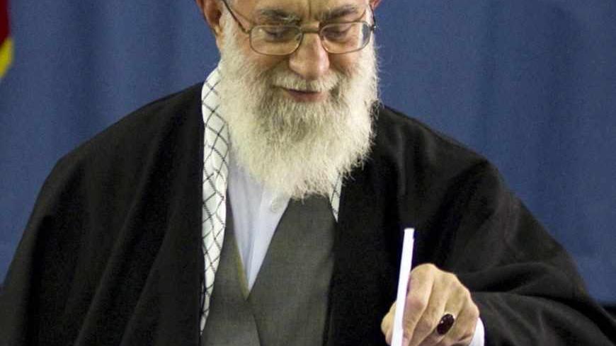 EDITORS' NOTE: Reuters and other foreign media are subject to Iranian restrictions on leaving the office to report, film or take pictures in Tehran.
Iran's Supreme Leader Ayatollah Ali Khamenei casts his ballot in the parliamentary election in Tehran March 2, 2012.  Polls opened on Friday for a parliamentary election in Iran that will test the popularity of the clerical establishment at a time of a standoff with the West over the country's nuclear programme.  REUTERS/Caren Firouz (IRAN - Tags: POLITICS ELE