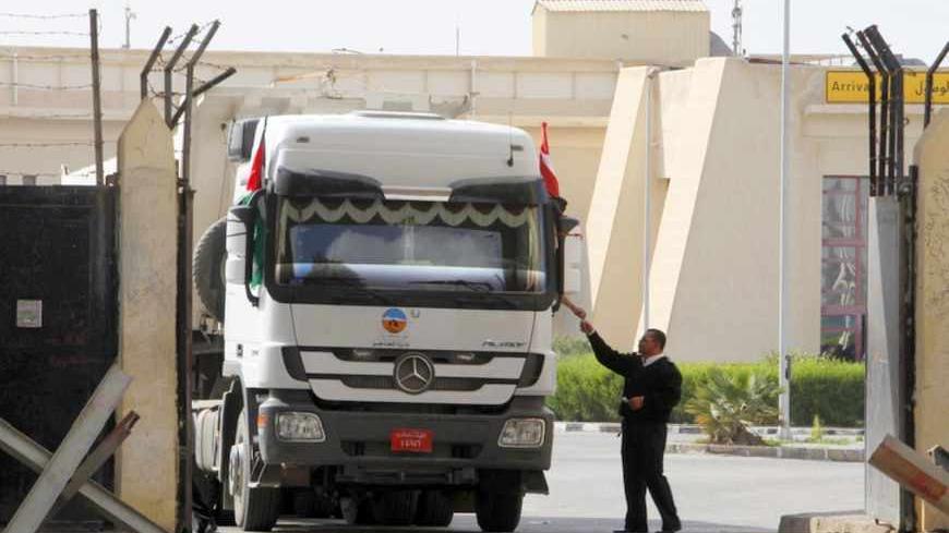 A truck loaded with building materials drives at the Rafah crossing with Egypt, in the southern Gaza Strip December 30, 2012. Islamist-led Egypt allowed building materials into Gaza via the Rafah crossing on Saturday for the first time since Hamas seized control of the Palestinian enclave in 2007, an Egyptian border official said. REUTERS/Ibraheem Abu Mustafa (GAZA - Tags: POLITICS CONSTRUCTION) - RTR3BZDB
