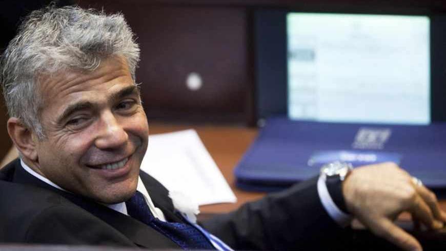 Yair Lapid, head of Yesh Atid (There is a Future) party attends the swearing-in ceremony of the 19th Knesset, the new Israeli parliament, in Jerusalem February 5, 2013. REUTERS/Uriel Sinai/Pool (JERUSALEM - Tags: POLITICS) - RTR3DDXV