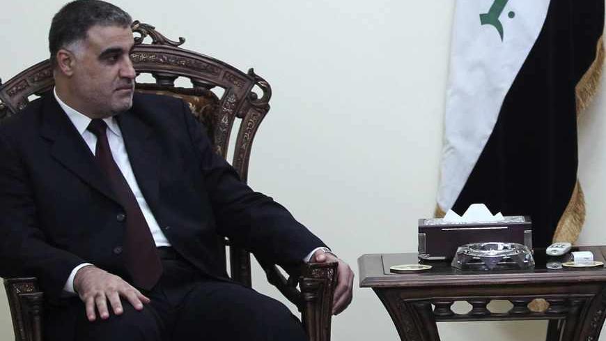 Iraq's Deputy Prime Minister Rafi Essawi (R) meets with Hassan al-Shammari, head of the Iraqi Islamic al Fadila parliamentary bloc, in Baghdad October 1, 2010. REUTERS/Mohammed Ameen (IRAQ - Tags: POLITICS) - RTXSX67