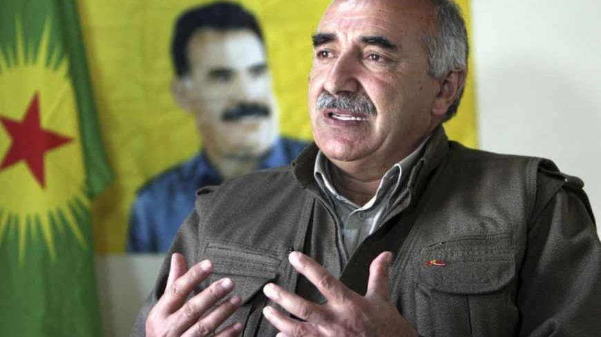 Murat Karayilan, acting military commander of the Kurdistan Workers Party (PKK), speaks during an interview with Reuters at the Qandil mountains near the Iraq-Turkish border in Sulaimaniya, 330 km (205 miles) northeast of Baghdad March 24, 2013. Shattered stone houses recall Turkish air strikes on Kurdish rebels holed up in the Qandil mountains of northern Iraq. Life is harsh amid the snowcapped peaks, supplies are sparse and armed forays across into Turkey perilous in the extreme. Yet rebel chief Abdullah 