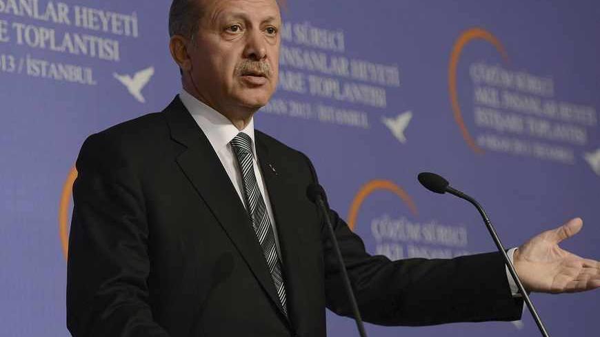 Turkey's Prime Minister Tayyip Erdogan makes his address during a meeting with the 'wise people' commission in Istanbul April 4, 2013, in this picture provided by the Turkish Prime Minister's Press Office. Erdogan chaired an inaugural meeting of the 'wise people' commission, who will be consulted on a peace process with Kurdish militants. The commission is made up of academics, journalists and performing artists, and established by the government to promote the peace process nationwide. REUTERS/Kayhan Ozer/