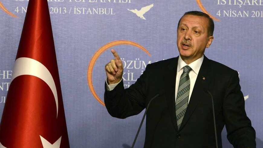 Turkey's Prime Minister Tayyip Erdogan makes his address during a meeting with the 'wise people' commission in Istanbul April 4, 2013. Erdogan chaired an inaugural meeting of the 'wise people' commission, who will be consulted on a peace process with Kurdish militants. The commission is made up of academics, journalists and performing artists, and established by the government to promote the peace process nationwide. REUTERS/Metin Pala/Pool (TURKEY - Tags: POLITICS CIVIL UNREST) - RTXY8EB