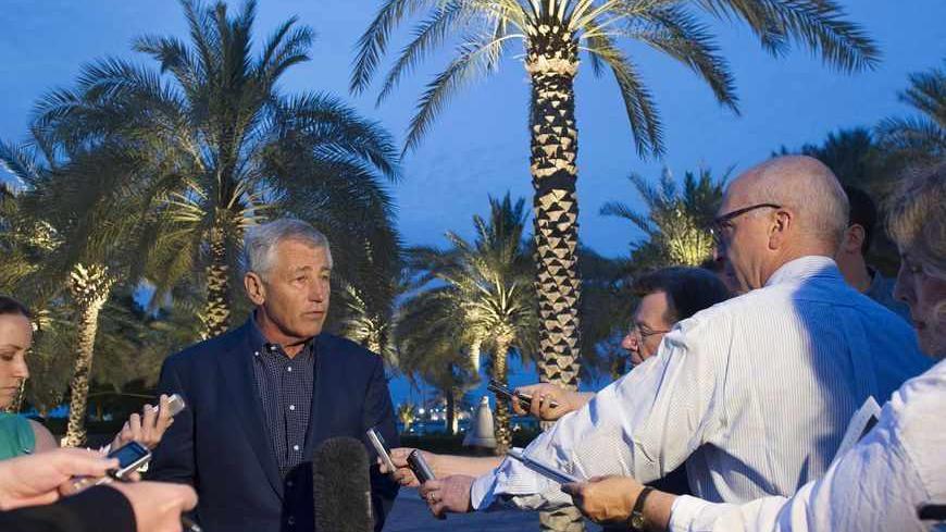 U.S. Secretary of Defense Chuck Hagel speaks with reporters after reading a statement on chemical weapon use in Syria during a news conference in Abu Dhabi April 25, 2013. Hagel on Thursday said the U.S. intelligence community believes the Syrian government has used sarin gas on a small scale against rebels trying to overthrow the government of Bashar al-Assad. REUTERS/Jim Watson/Pool (UNITED ARAB EMIRATES - Tags: POLITICS) - RTXYZQ8