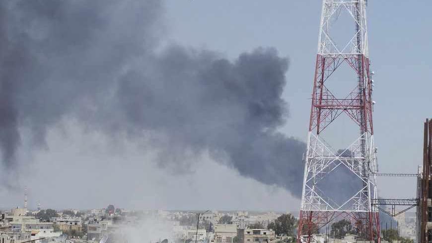 Smoke rises after what activists said was a missile fired by a Syrian Air Force fighter jet loyal to President Bashar al-Assad in Deraa, April 26, 2013. REUTERS/Mazen Abu Mahmoud/Shaam News Network/Handout (SYRIA - Tags: POLITICS CIVIL UNREST) ATTENTION EDITORS - THIS PICTURE WAS PROVIDED BY A THIRD PARTY. REUTERS IS UNABLE TO INDEPENDENTLY VERIFY THE AUTHENTICITY, CONTENT, LOCATION OR DATE OF THIS IMAGE. FOR EDITORIAL USE ONLY. NOT FOR SALE FOR MARKETING OR ADVERTISING CAMPAIGNS. THIS PICTURE IS DISTRIBUTE