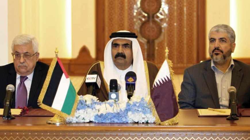 Qatari Emir Sheikh Hamad Bin Khalifa Al-Thani (C) Palestinian President Mahmoud Abbas (L) and Hamas leader Khaled Meshaal attend a ceremony in Doha, on February 6, 2012.  Abbas will head an interim national consensus government under a deal signed in Qatar between Abbas and Meshaal , ending a long-running disagreement that had stalled Palestinian reconciliation.
AFP PHOTO/STR (Photo credit should read -/AFP/Getty Images)