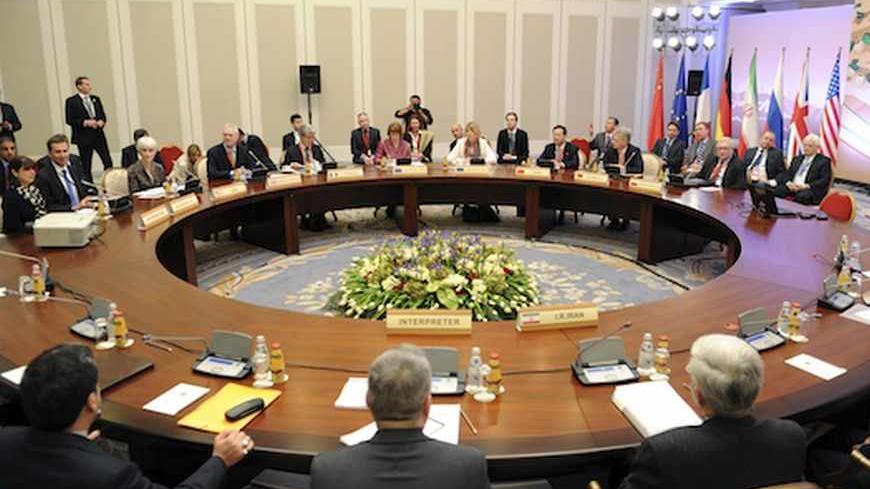 Participants from the U.S., Russia, China, France, Britain and Germany prepare to start talks with Iranian negotiators in Almaty April 5, 2013. World powers will urge Iran on Friday to accept their offer to ease some economic sanctions if it stops its most sensitive nuclear work, in talks aimed at easing tensions that threaten to boil over into war. REUTERS/Ilyas Omarov/Pool (KAZAKHSTAN - Tags: POLITICS) - RTXY96H