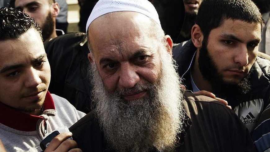 Mohammed al-Zawahiri (C), leader of Salafi Jihad in Egypt, takes part in a demonstration organised by Egyptian Islamists against the French intervention in Mali on January 18, 2013 in Cairo. The brother of Al-Qaeda chief Ayman al-Zawahiri joined dozens of Egyptian Islamists in a protest near the French embassy in Cairo. AFP PHOTO/GIANLUIGI GUERCIA        (Photo credit should read GIANLUIGI GUERCIA/AFP/Getty Images)