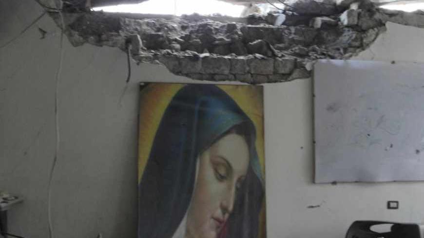 A damaged church is seen in the old city of Homs September 30, 2012. Picture taken September 30, 2012. REUTERS/Shaam News Network/Handout (SYRIA - Tags: POLITICS CIVIL UNREST RELIGION) FOR EDITORIAL USE ONLY. NOT FOR SALE FOR MARKETING OR ADVERTISING CAMPAIGNS. THIS IMAGE HAS BEEN SUPPLIED BY A THIRD PARTY. IT IS DISTRIBUTED, EXACTLY AS RECEIVED BY REUTERS, AS A SERVICE TO CLIENTS - RTR38NET