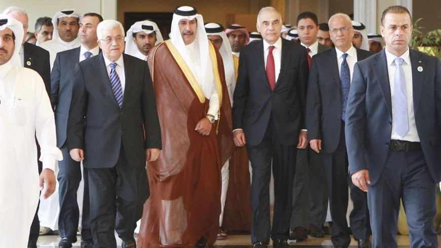Palestinian President Mahmoud Abbas (centre L), Qatari Prime Minister and Foreign Minister Hamad bin Jassim al-Thani (C) and Egyptian Foreign Minister Mohamed Kamel Amr (centre R) arrive to the Arab Peace Initiative Committee Meeting in Doha December 9, 2012. REUTERS/Mohammed Dabbous (QATAR - Tags: POLITICS) - RTR3BDR2