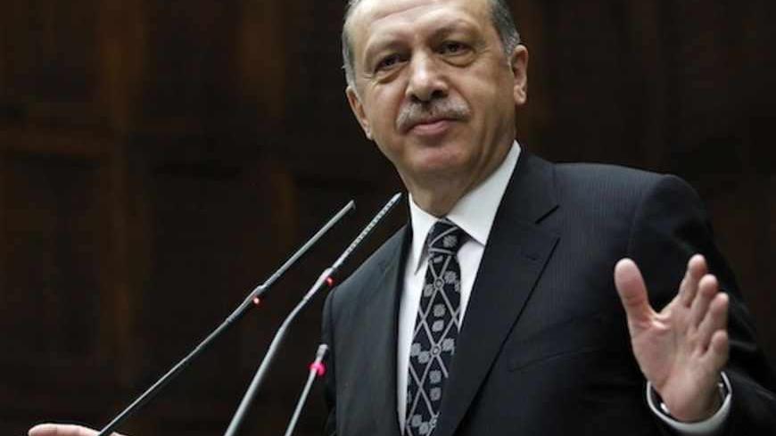 Turkey's Prime Minister Tayyip Erdogan addresses members of parliament from his ruling AK Party (AKP) during a meeting at the Turkish parliament in Ankara April 16, 2013. REUTERS/Umit Bektas (TURKEY - Tags: POLITICS) - RTXYNFY