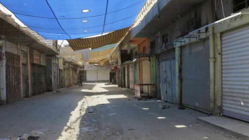 A view of a row of closed shops during a nationwide strike in Ramadi, 100 km (62 miles) west of Baghdad, April 22, 2013. Iraqis in Sunni provinces boycotted government offices, closed shops and deserted universities on Monday in the latest protests by the minority sect which fears it is being marginalised by Shi'ite Prime Minister Nuri al-Maliki.Streets in the Sunni-majority provinces of Anbar, Nineveh and Salahuddin were mostly empty after people shuttered their shops or stayed away from work in what prote