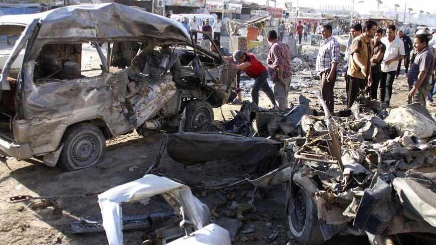 Residents gather at the site of a car bomb attack in Baghdad's Husseiniya district, April 25, 2013. At least eight people were killed and 23 wounded when a car bomb exploded in eastern Baghdad, police and medical sources said on Wednesday. REUTERS/Wissm al-Okili (IRAQ - Tags: CIVIL UNREST CRIME LAW) - RTXYZ6J