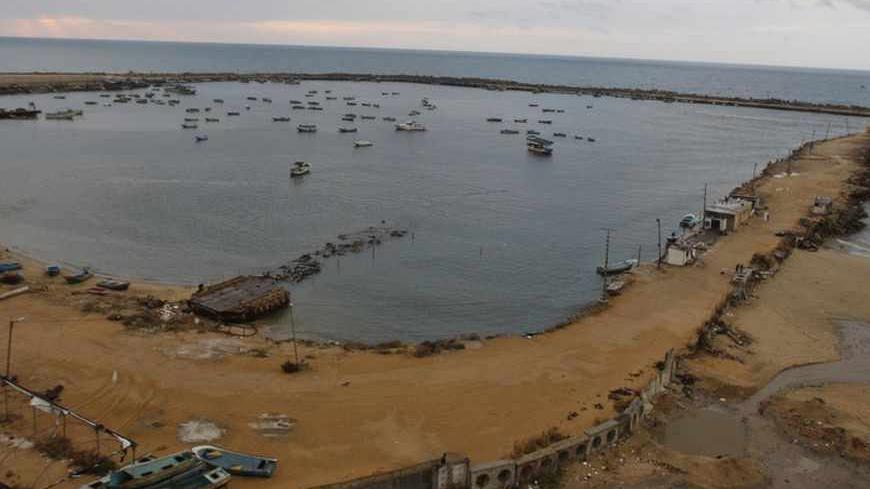 Fishing boats are seen at Gaza Seaport in Gaza City November 24, 2012. Israel eased restrictions on Gaza fishermen on Saturday, further implementing a three-day-old truce brokered by Egypt after a week of fierce fighting, Palestinian officials said. REUTERS/Ahmed Zakot (GAZA - Tags: POLITICS CIVIL UNREST CONFLICT) - RTR3ATKD