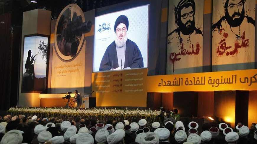Shi'ite, Sunni Muslim and Druze Lebanese clerics listen to Lebanon's Hezbollah leader Sayyed Hassan Nasrallah addressing his supporters during a rally to commemorate Martyrs' Day in Beirut, February 16, 2013.  REUTERS/Sharif Karim (LEBANON - Tags: POLITICS) - RTR3DVC0