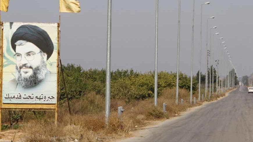 A picture of Lebanon's Hezbollah leader Sayyed Hassan Nasrallah is seen in Masharih Al-Qaa in Bekaa Valley October 17, 2012. Lebanon's greatest worry is that the sectarian divide in Syria could drive the violence across the frontier. Lebanon's own delicate political and religious structure has already been shaken by the Syria conflict, and the fuse that would blow it up could be lit in Bekaa. Syria's mainly Sunni Muslim opposition and its international supporters say the valley has become a base for Lebanon