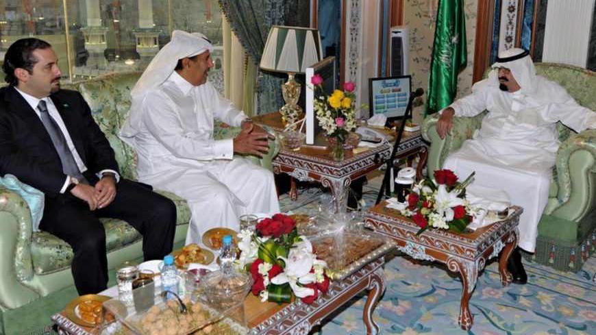 Saudi Arabia King Abdullah bin Abdulaziz (R) meets with Qatari Prime Minister and Foreign Minister Sheikh Hamad bin Jassim bin Jabor Al Thani (C) and Lebanon's former prime minister Saad al-Hariri at the Royal Palace in Mecca August 13, 2012. REUTERS/Saudi Press Agency/Handout (SAUDI ARABIA - Tags: POLITICS) FOR EDITORIAL USE ONLY. NOT FOR SALE FOR MARKETING OR ADVERTISING CAMPAIGNS. THIS IMAGE HAS BEEN SUPPLIED BY A THIRD PARTY. IT IS DISTRIBUTED, EXACTLY AS RECEIVED BY REUTERS, AS A SERVICE TO CLIENTS - R