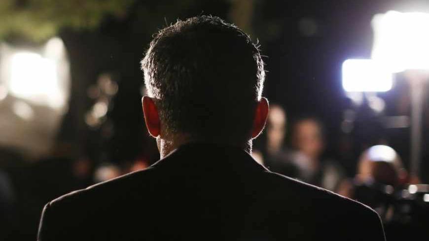 Yair Lapid, leader of the Yesh Atid (There's a Future) party, speaks to members of the media outside his home in Tel Aviv January 23, 2013. Lapid, a former television news anchor whose new centrist party stormed to second place in Israel's election, may well be the kingmaker holding the keys to the next coalition government. REUTERS/Amir Cohen (ISRAEL - Tags: POLITICS ELECTIONS) - RTR3CUU2
