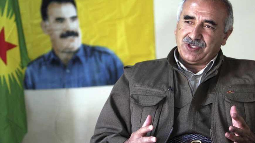 Murat Karayilan, acting military commander of the Kurdistan Workers Party (PKK), speaks during an interview with Reuters at the Qandil mountains near the Iraq-Turkish border in Sulaimaniya, 330 km (205 miles) northeast of Baghdad March 24, 2013. Shattered stone houses recall Turkish air strikes on Kurdish rebels holed up in the Qandil mountains of northern Iraq. Life is harsh amid the snowcapped peaks, supplies are sparse and armed forays across into Turkey perilous in the extreme. Yet rebel chief Abdullah 