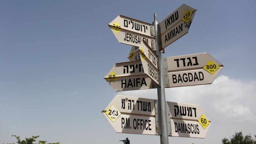 A sign post near Kibbutz Merom Golan in the Golan Heights shows the distance from Israel's northern border to other destinations May 2, 2013. Israel's military said on Tuesday it had called up hundreds of reservists for a drill in northern Israel where tensions are high with neighbours Syria and Lebanon, but a military spokesman said there was no change in the overall security situation. Israel captured the Golan Heights from Syria in the 1967 Middle East war and annexed the territory in 1981, a move not re