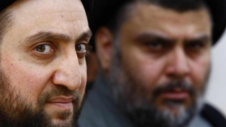 Ammar al-Hakim (L), leader of the Islamic Supreme Council of Iraq (ISCI) and Iraqi Shi'ite cleric Moqtada al-Sadr hold a news conference in Najaf, 160 km (100 miles) south of Baghdad, May 8, 2013. REUTERS/Haider Ala  (IRAQ - Tags: POLITICS) - RTXZEUL