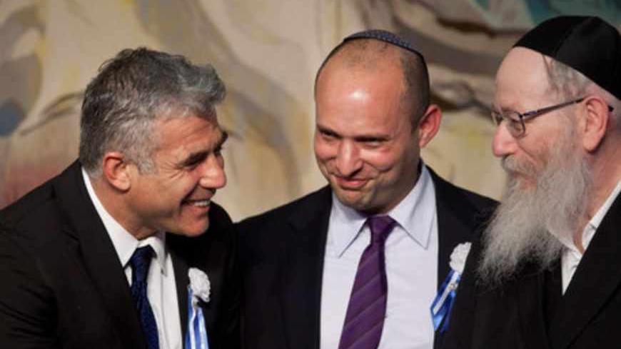 JERUSALEM, ISRAEL - FEBRUARY 05:  Israeli politician Yair Lapid (L), leader of the Yesh Atid party, speaks to Naftali Bennett, head of the Israeli hardline national religious party the Jewish Home (C) and Yaakov Litzman (R) head of the Agudat Yisrael Ultra orthodox party during a reception marking the opening of the 19th Knesset (Israeli parliament) on February 5, 2013 in Jerusalem, Israel.  The 120 members of the Knesset included a record 48 new law makers.  (Photo by Uriel Sinai/Getty Images)