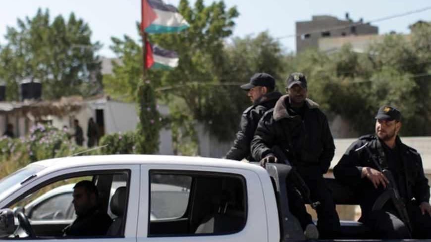 Hamas security men stand guard on the border between Gaza city and Israel to prevent any Palestinian collaborators from escaping to Israel on April 10, 2013. Hamas accused Western and Arab spy agencies of operating in the Gaza Strip and said it had a list of alleged collaborators. AFP PHOTO/MAHMUD HAMS (Photo credit should read MAHMUD HAMS/AFP/Getty Images)