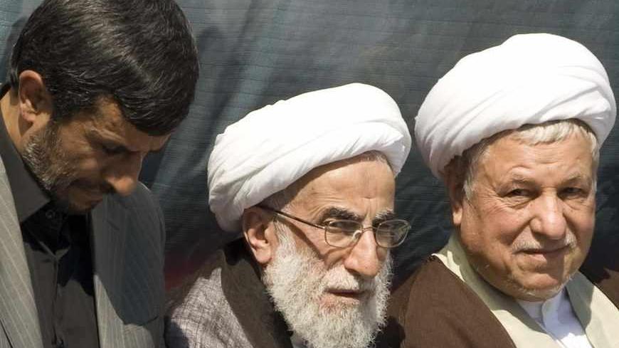 (L-R) Iran's President Mahmoud Ahmadinejad, Guardian Council head Ayatollah Ahmad Janati and former President Akbar Hashemi Rafsanjani listen to the speech of supreme leader Ayatollah Ali Khamenei during a ceremony to mark the 20th anniversary of the death of the founder of the Islamic Republic Ayatollah Ruhollah Khomeini at the Behesht Zahra cemetary south of Tehran June 4, 2009. Khamenei said on Thursday the United States was deeply hated in the Middle East and told U.S. President Barack Obama that "beaut