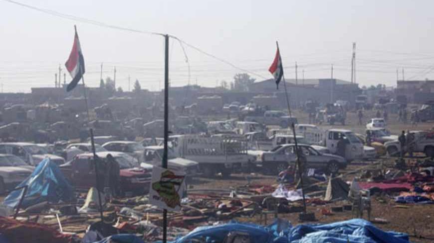 A view of a destroyed makeshift camp at a public square in Hawija, near Kirkuk, 170 km (100 miles) north of Baghdad April 23, 2013. Iraqi forces stormed the Sunni Muslim protest camp on Tuesday, and more than 50 people were killed in the ensuing clashes which spread beyond the town of Hawija, to other areas. Picture taken April 23, 2013.   REUTERS/Stringer (IRAQ - Tags: CIVIL UNREST MILITARY POLITICS) - RTXYZEU
