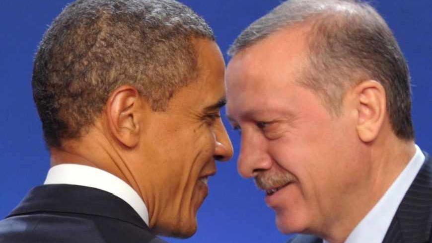 U.S. President Barack Obama (L) and Turkey's Prime Minister Recep Tayyip Erdogan take part in a family photo during the G20 Summit of major world economies in Cannes November 3, 2011.   REUTERS/Philippe Wojazer (FRANCE  - Tags: POLITICS BUSINESS)   - RTR2TKEP
