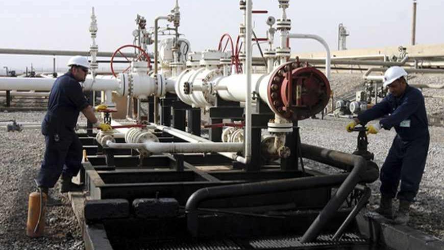 Workers adjust a valve of an oil pipe in Tawke oil field near Dahuk, 400 km (249 miles) north of Baghdad, November 24, 2010. In this part of Iraq, the hillsides sweat oil. Without any coaxing, the sticky black treasure oozes from the layered rock and gathers in pools that bubble as dissolved gases surface. Gradually, as the crude slips down the hillsides, it solidifies into a grey mass that resembles a hardened lava flow. It's a good metaphor for the progress of oil from the semi-autonomous Iraqi region of 