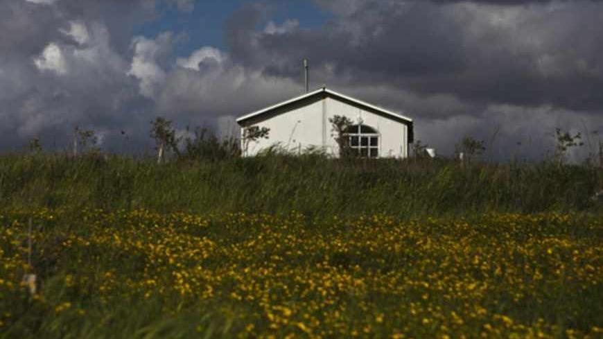 A house is seen at the unauthorised Jewish settler outpost of Havat Gilad, south of the West Bank city of Nablus March 17, 2013. U.S. President Barack Obama is due to make his first official visit to Israel and the Palestinian Territories this week, looking to improve ties after sometimes rocky relations with both sides during his first term in office. Israeli settlement expansion lies at the heart of much of the rancour between Israeli Prime Minister Benjamin Netanyahu and Obama, who has said the U.S. does