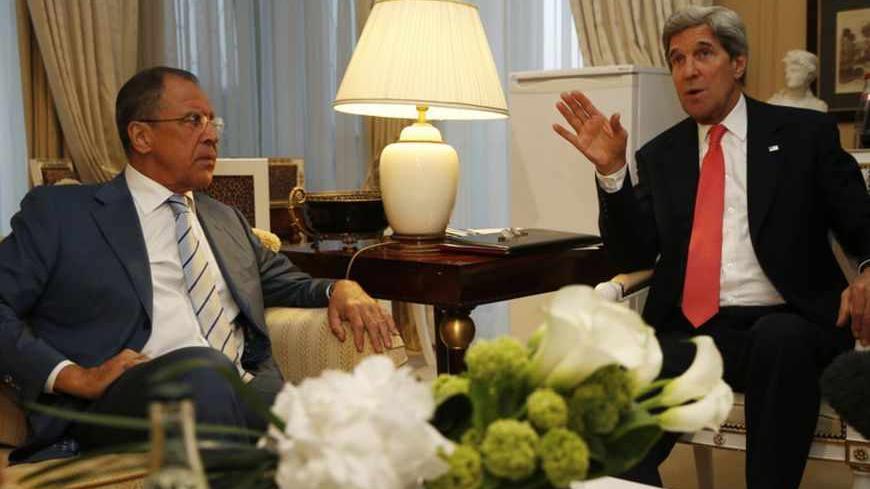 U.S. Secretary of State John Kerry (R) meets with Russian Foreign Minister Sergei Lavrov in Paris, May 27, 2013.  REUTERS/Jim Young  (FRANCE - Tags: POLITICS) - RTX103D0